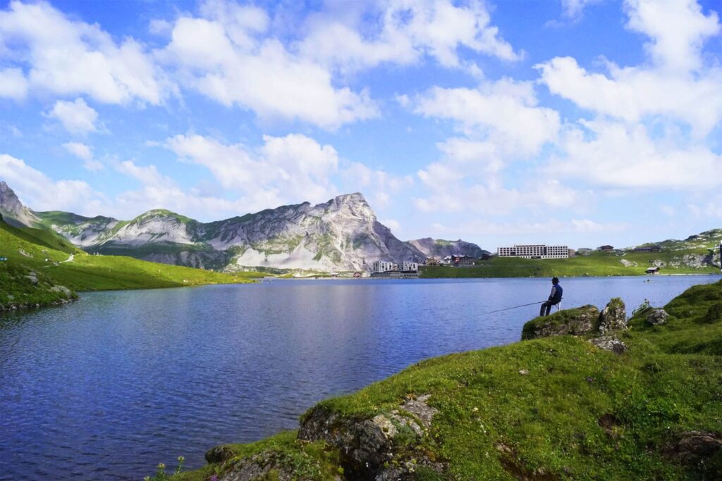 Wonderful panoramic view over Melchsee, the Frutt Lodge and the fisherman. Melchsee Frutti s such a beautiful mountain area.