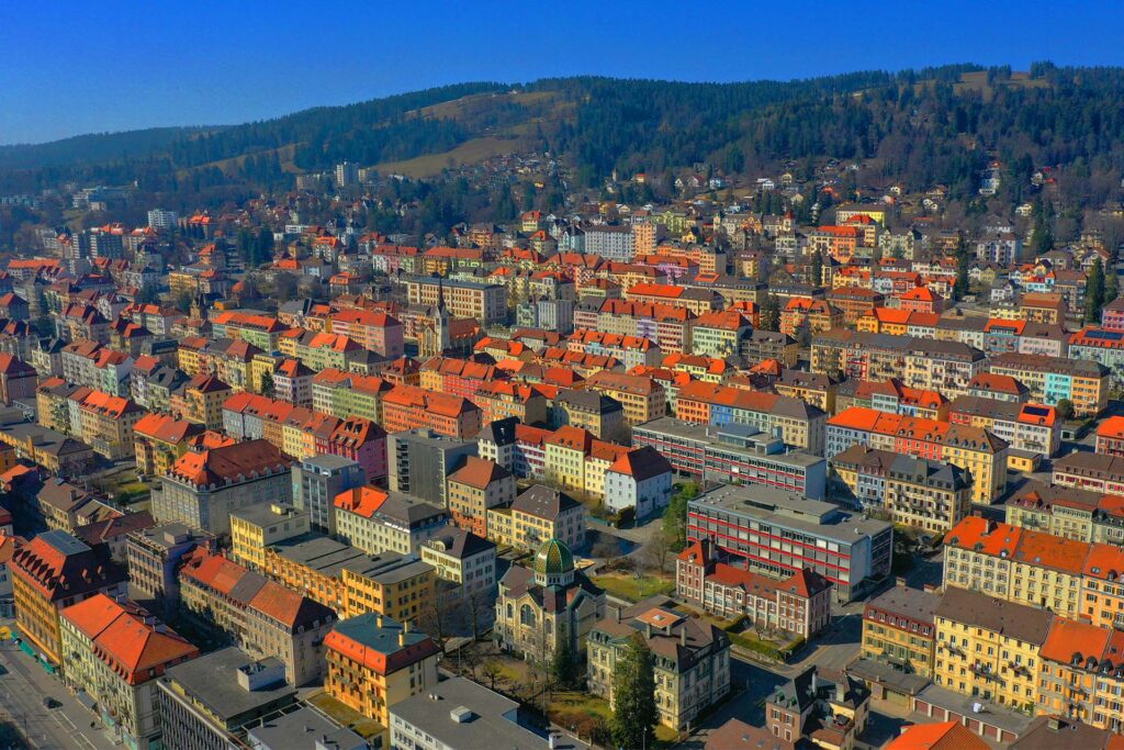 : La Chaux de Fonds is the city of Swiss watches and famous designers such as Le Corbusier with his Maison Blanche La Chaux de Fonds. The Swiss city is a UNESCO World Heritage Site.