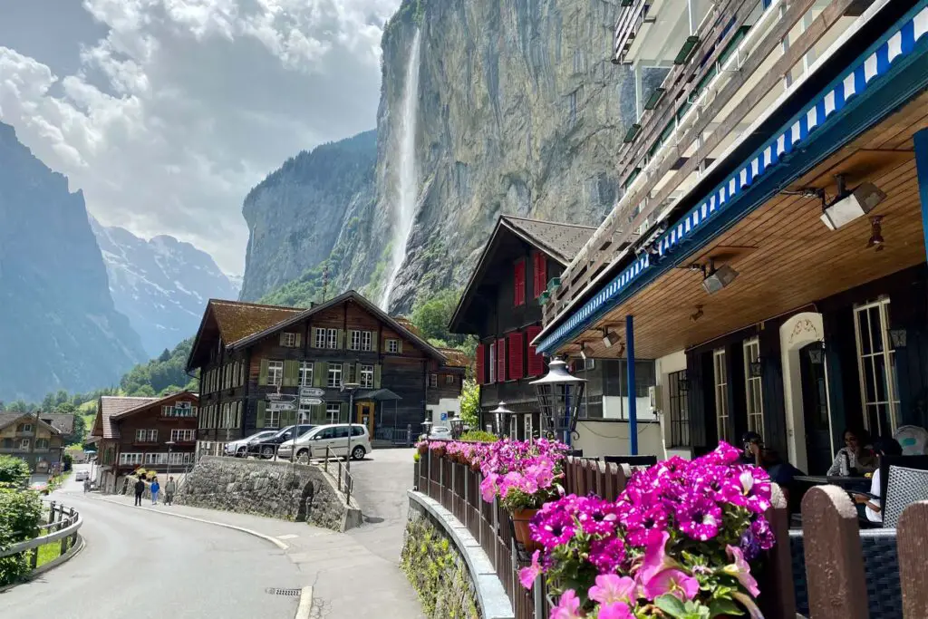Lauterbrunnen with the Staubbach Falls in the background, one of the tallest waterfalls in Europe.